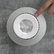 Illustration for article titled Control This Beautiful Ceramic Radio By Touching Its Palladium Surface